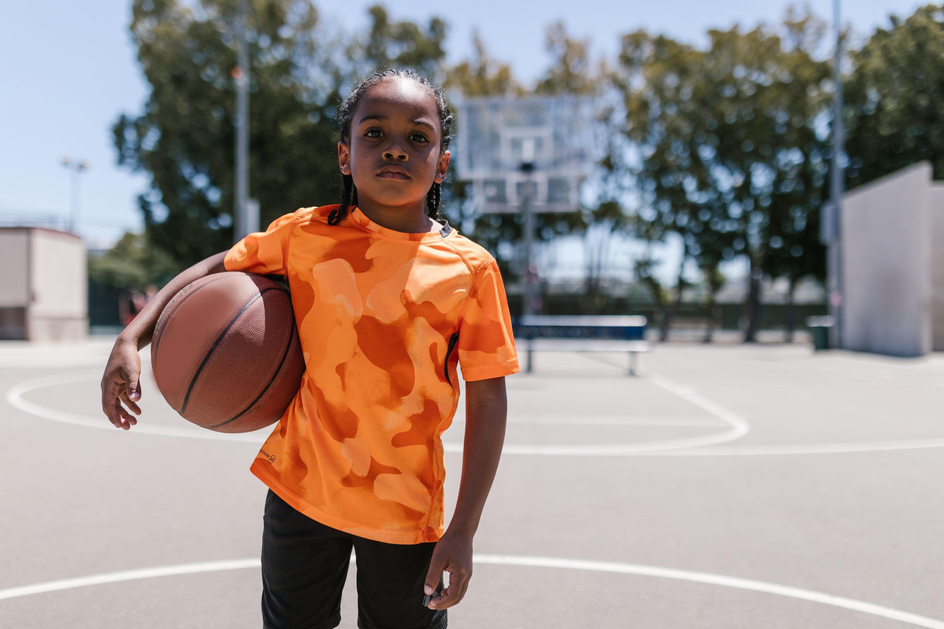 Young player standing under the hoop