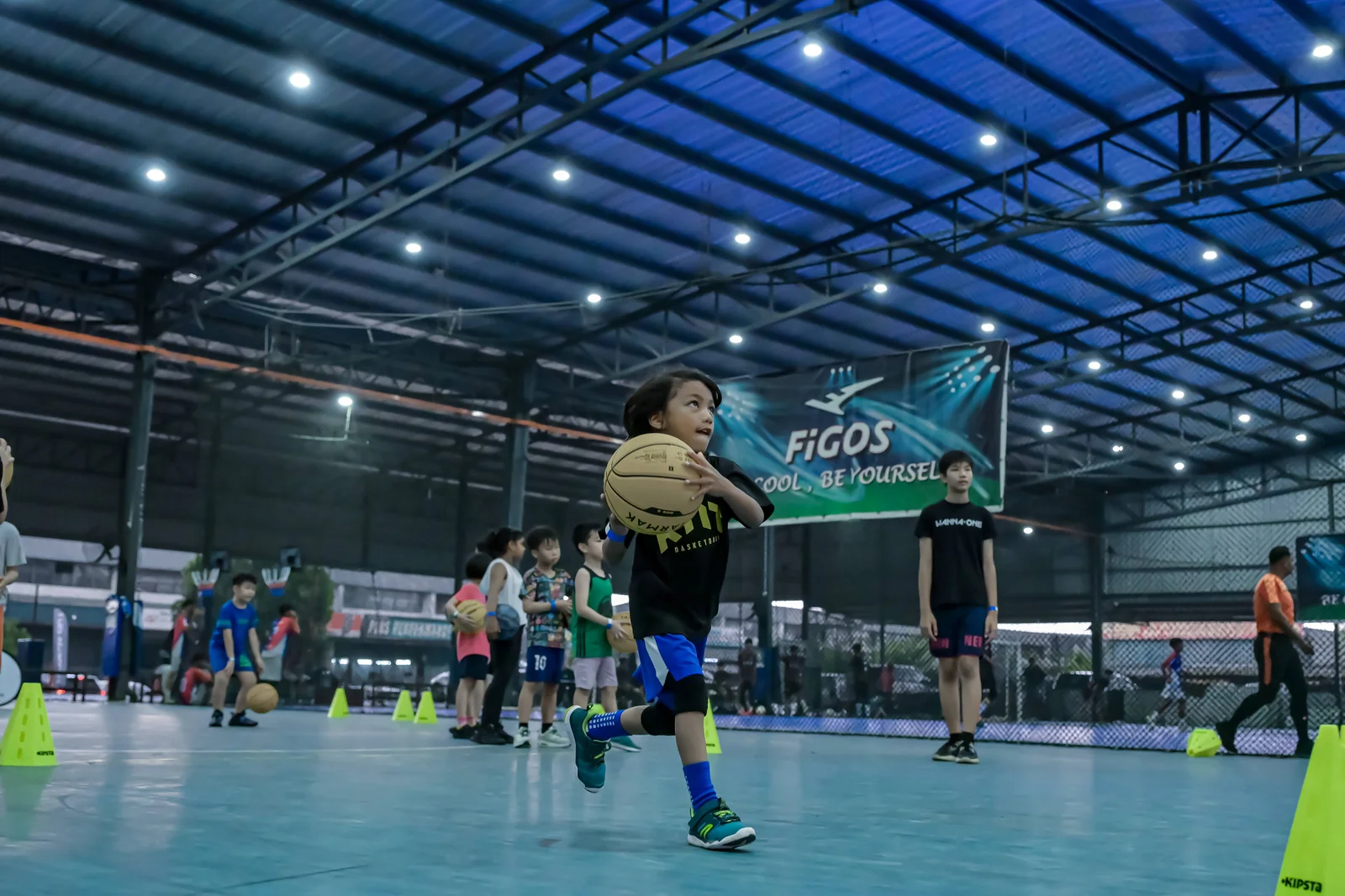 Kids ages 5–7 training together during academy sessions