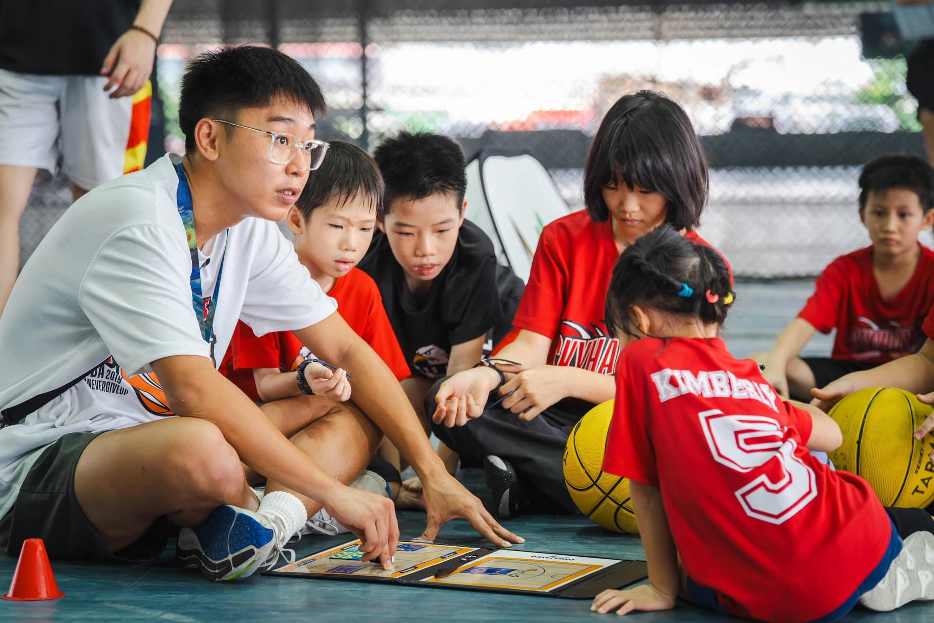 Kids playing basketball on court