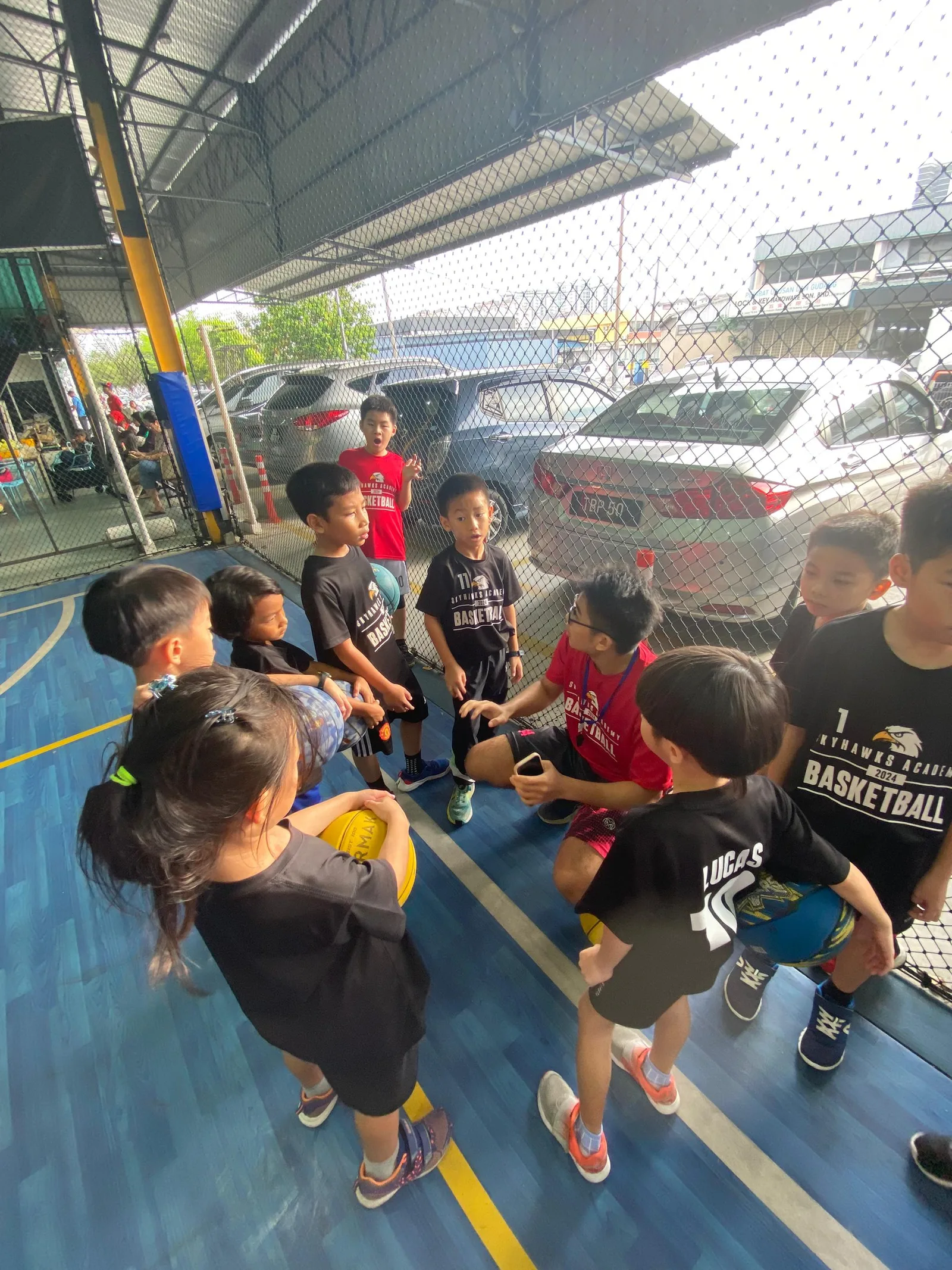 Kids playing in a friendly basketball match